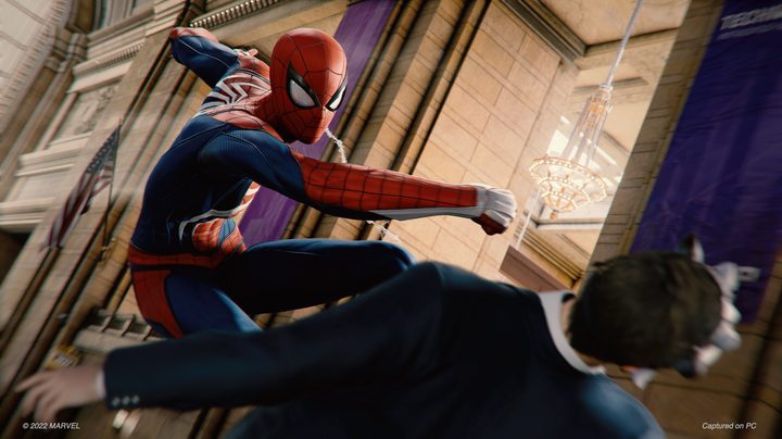 Spider-Man punches a man in Spider-Man Remastered.