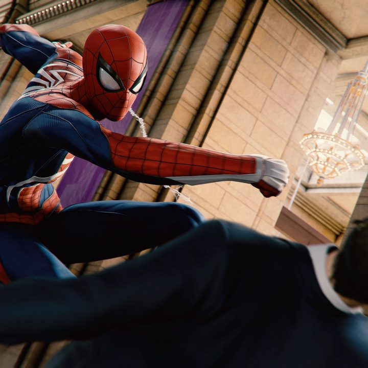 Spider-Man punches a man in Spider-Man Remastered.