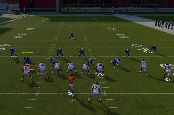 Two teams line up on the football practice field.