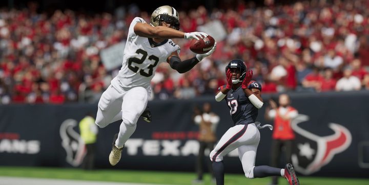 A Saints player catches a pass meant for a Falcons player.