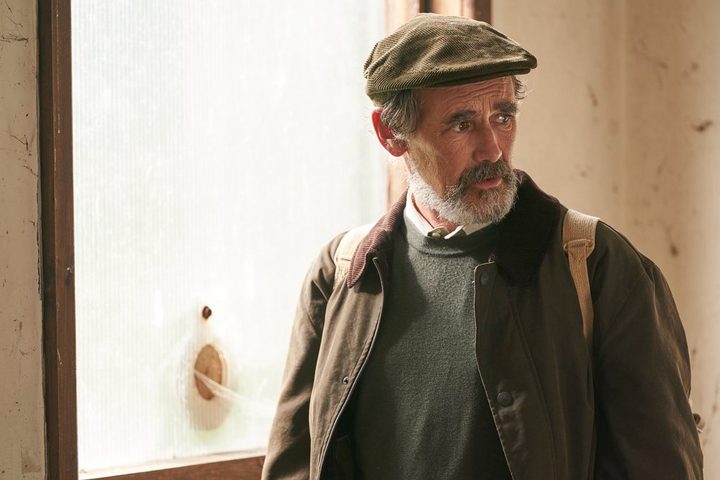 Mark Rylance stands near a window in The Undeclared War.