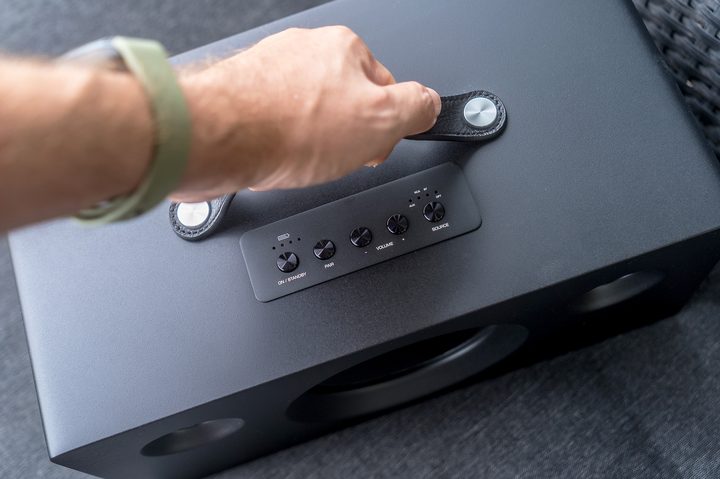 Holding the Monoprice Soundstage 3 Portable.