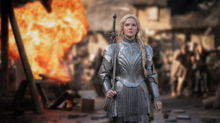 Morfydd Clark as Galadriel stands in armor in a scene from The Lord of the Rings: The Rings of Power.