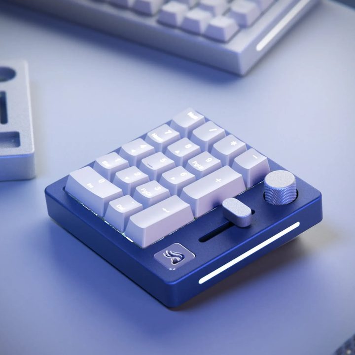 GMMK NumPad in black slate on a desk.
