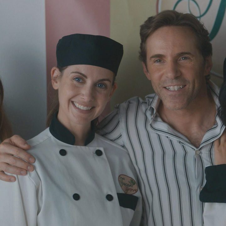 Aubrey Plaza, Alison Brie, Alessandro Nivola, and Ayden Mayeri pose for a picture in a scene from Spin Me Round.