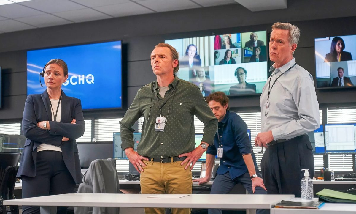 Simon Pegg and Alex Jennings stand in an office together in The Undeclared War.