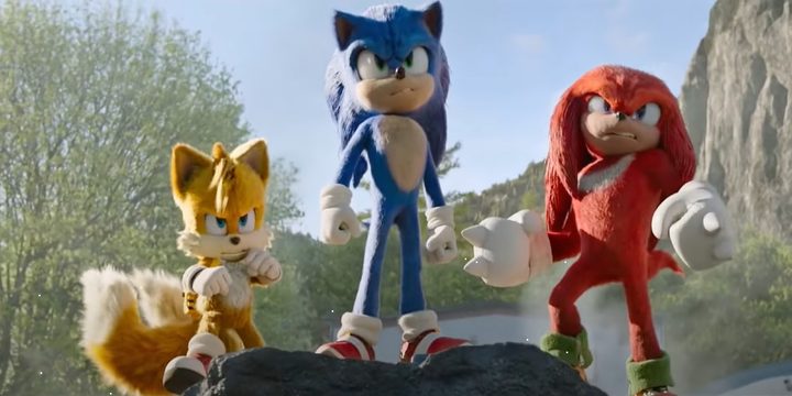 Sonic, Tails, and Knuckles stand beside each other in team formation in Sonic the Hedgehog 2.