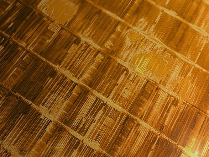 Super close-up view of 232-layer NAND wafer from Micron for next-gen storage.