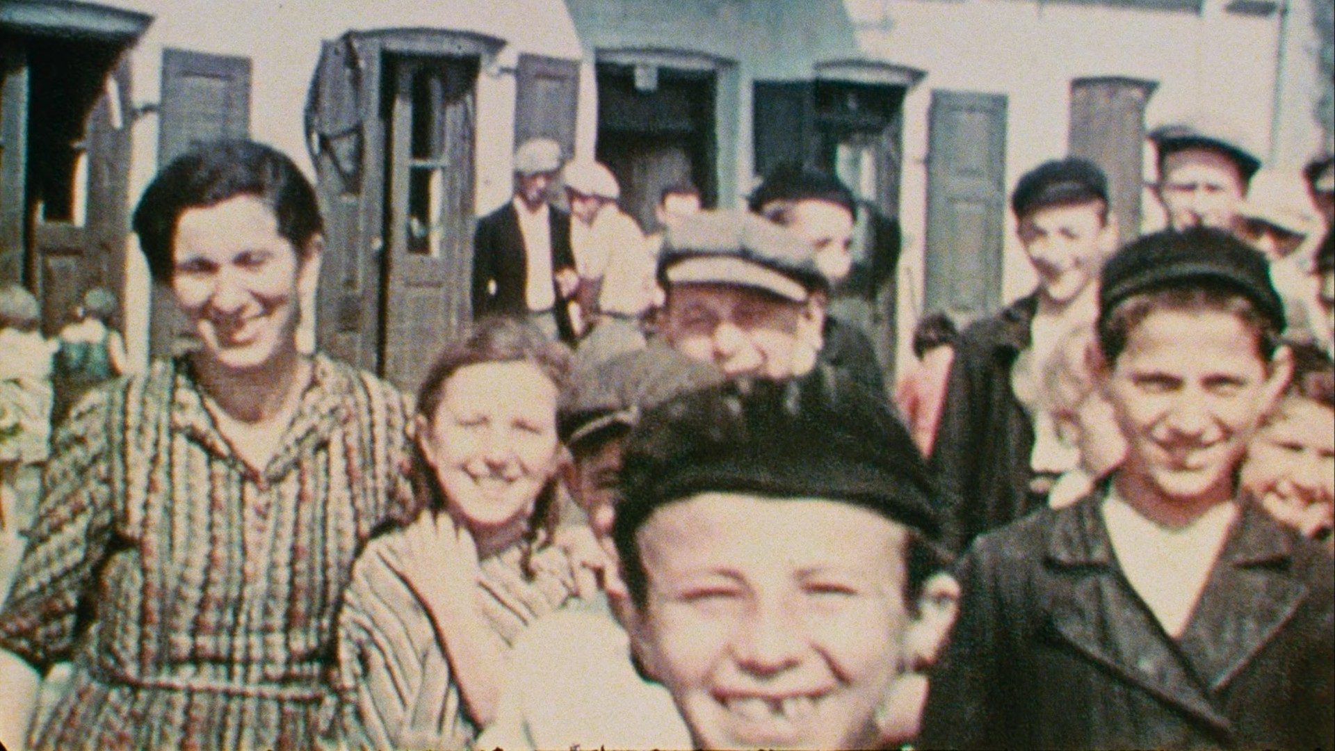 The people of Nasielsk stare into the camera.