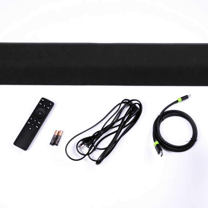 The soundbar, remote control, batteries, hdmi cable, and power cord are arranged on a white background.
