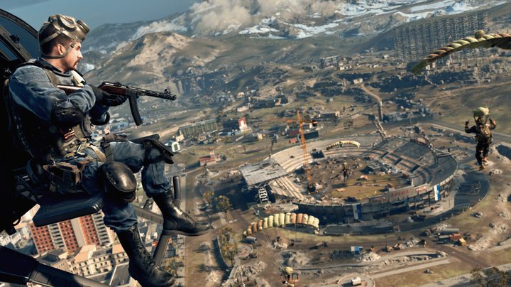 Character in helicopter flying over Verdansk in Warzone.