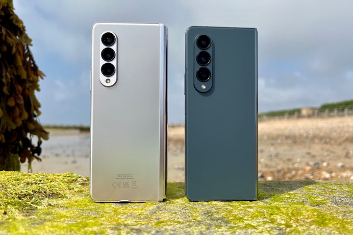 Galaxy Z Fold 4 and Z Fold 3 standing seen from the back.
