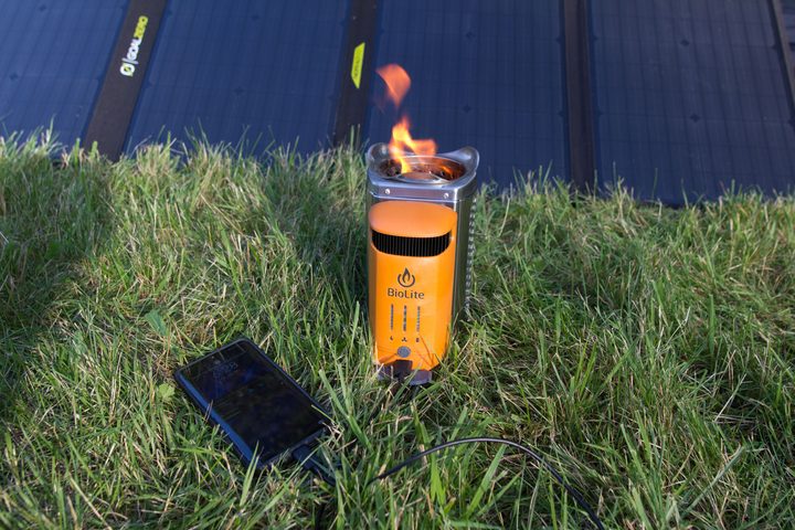 BioLite CampStove 2+ with phone plugged in and fire going.