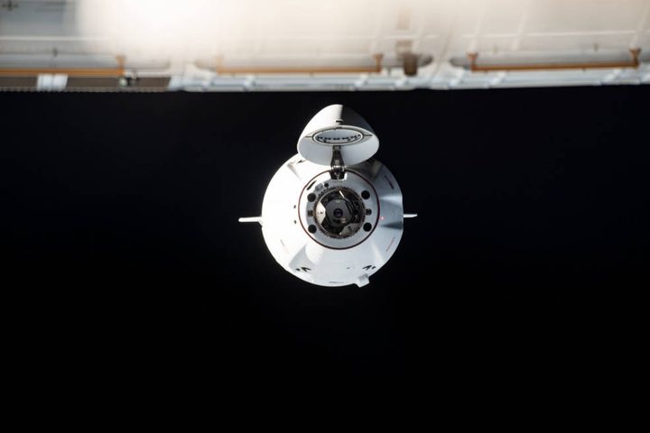 A SpaceX Crew Dragon approaches the space station.