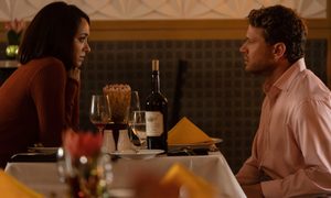 A man and a woman sit at a table in Collide.