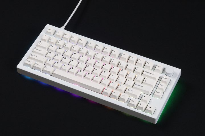 Drop Sense75 keyboard sitting on a black table.