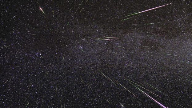A shower of Perseid meteors lights up the sky in 2009 in this NASA time-lapse image.