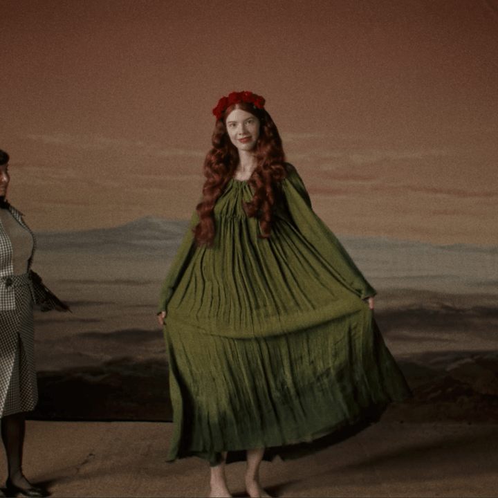 Marissa Marcel wears a green dress in Immortality.