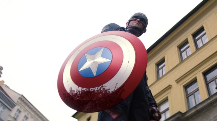 John Walker holds a bloodied shield in The Falcon and the Winter Soldier.