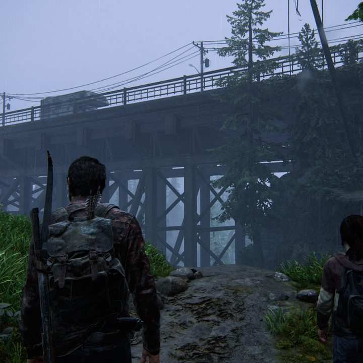 Joel and Ellie look at a bridge in The Last of Us Part I.