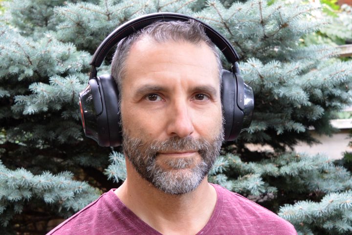 Front view of man wearing Mark Levinson No. 5909 headphones