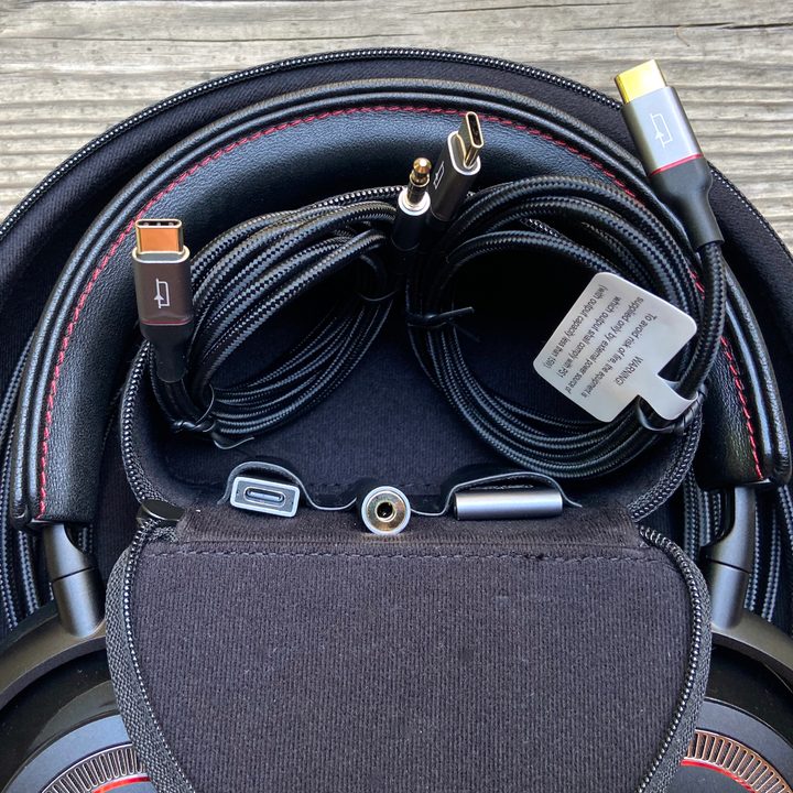 Mark Levinson No. 5909 headphones' carry case, open, showing accessories.