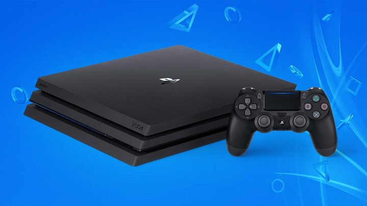 A PS4 sits in a blue room.