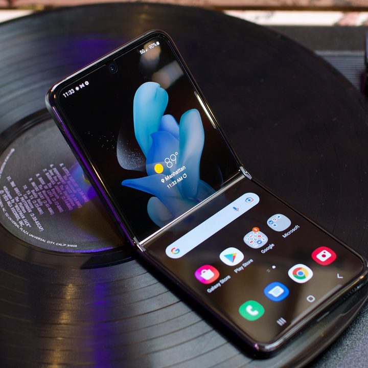 Samsung Galaxy Z Flip 4 sitting on a record player.