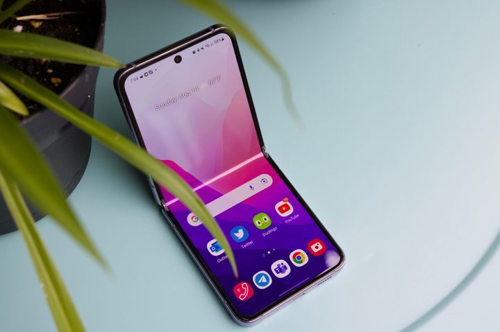 The Samsung Galaxy Z Flip 4, opened up and showing the main screen.