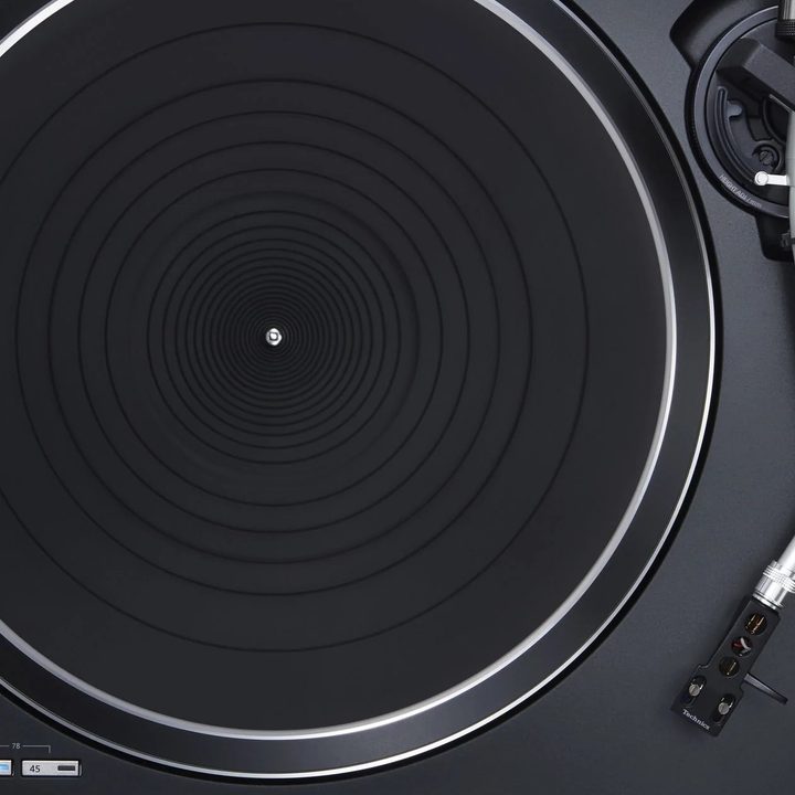 Technics SL-100C turntable on a white background.