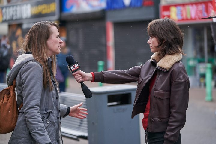 A woman interviews another woman outside in The Undeclared War.