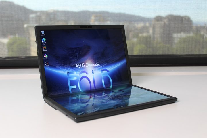 The Zenbook Fold 17 open on a table.