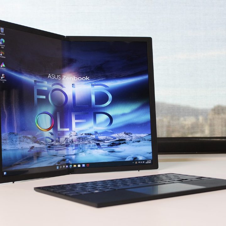 The foldable Zenbook Fold 17 on a desk with its detachable keyboard.