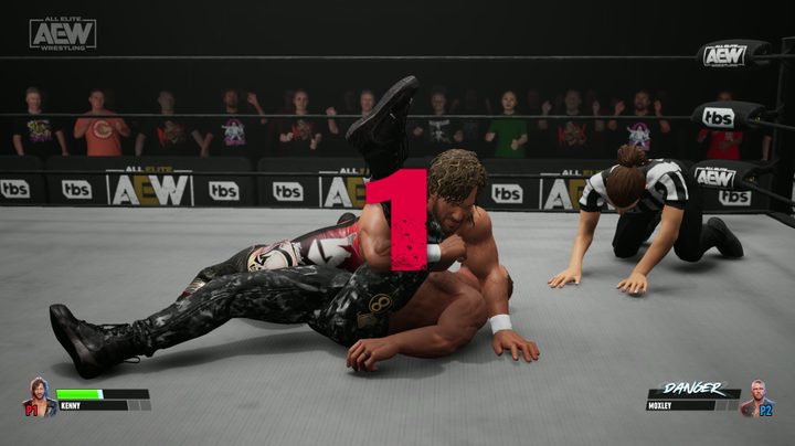 Kenny Omega pinning Jon Moxley in AEW: Fight Forever.