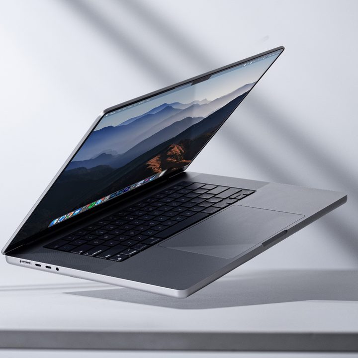 The Apple MacBook Pro 14 laptop propped up at an angle on a desk.