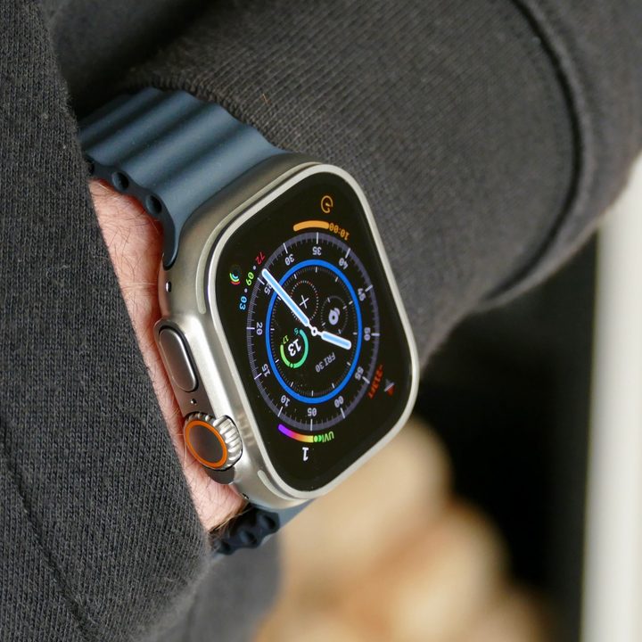 The Apple Watch Ultra on a man's wrist in a pocket.
