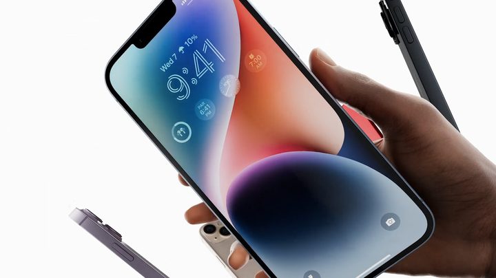 An iPhone 14 Plus in hand.