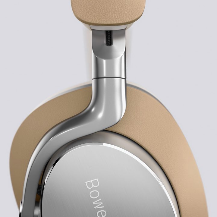Close-up of B&W Px8 wireless headphones in tan.