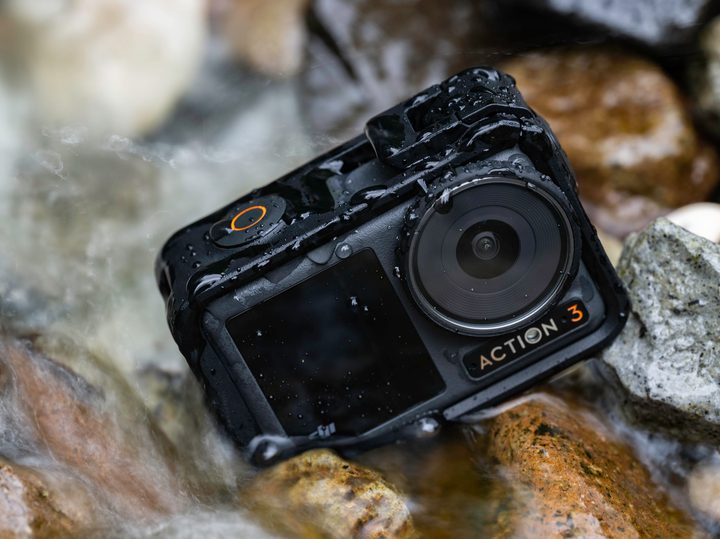 The DJI Osmo Action 3 in a rocky stream.