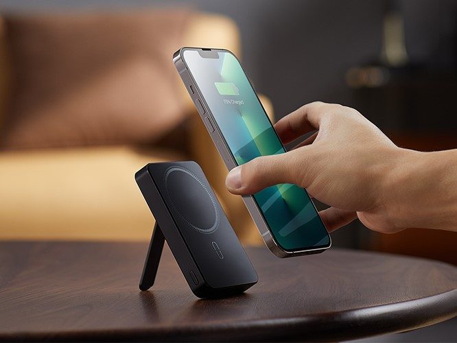 ESR HaloLock mini Kickstand and power bank with phone being attached.