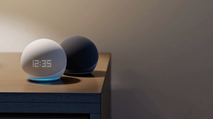 The Echo Dot with Clock sits on a table.