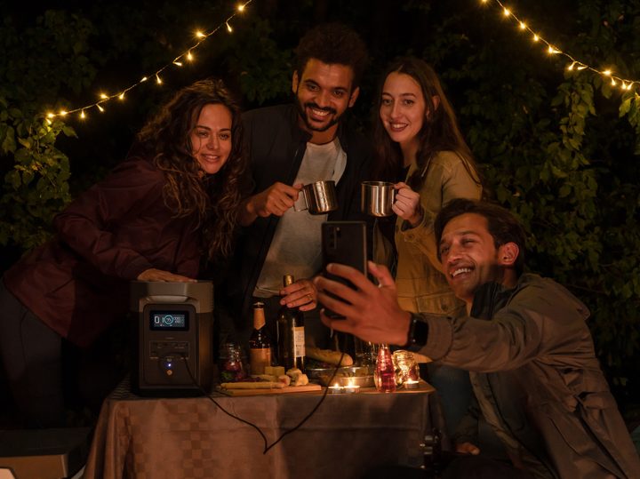 EcoFlow DELTA 2 powering outdoor party with friends.
