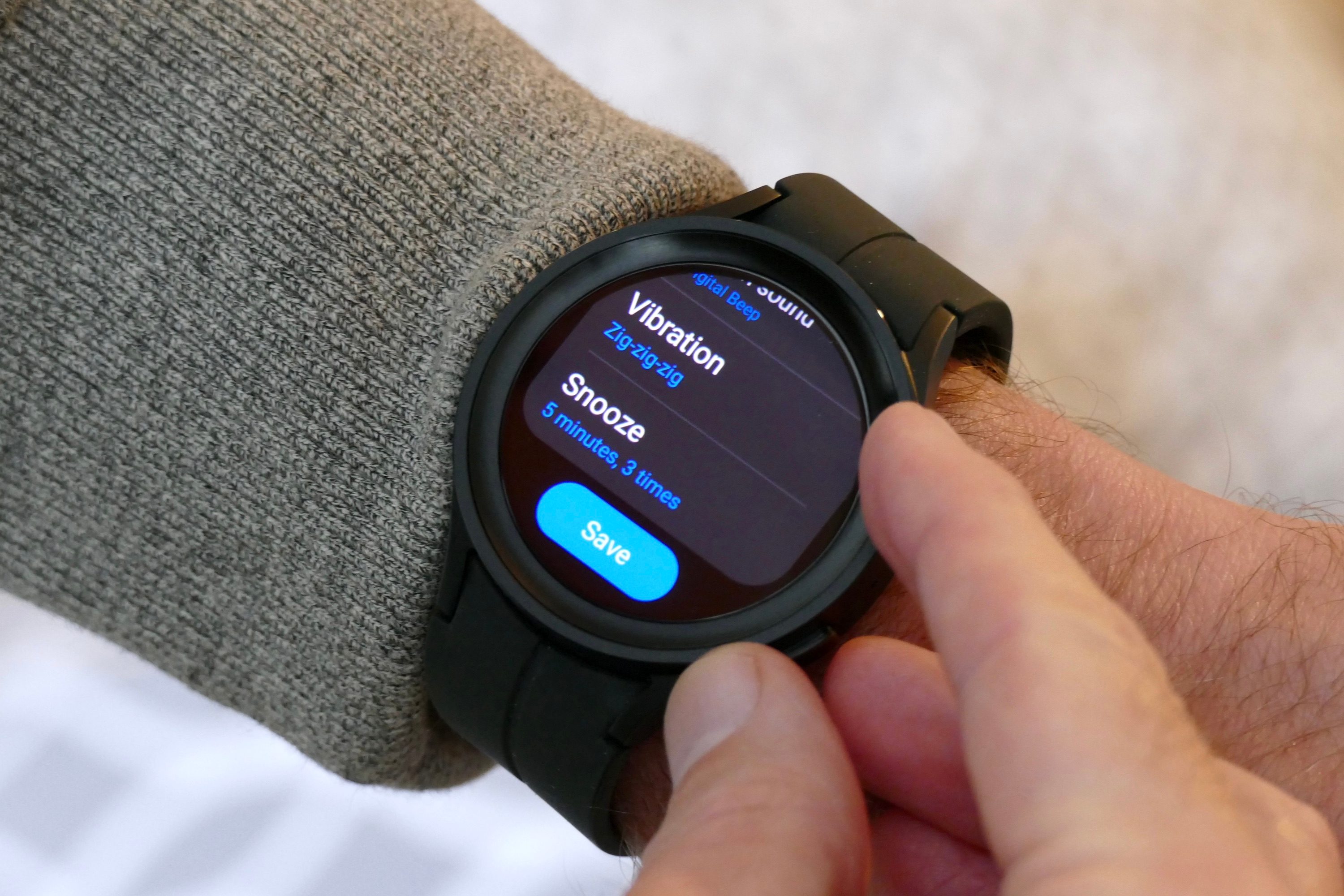 Setting an alarm on the Galaxy Watch 5 Pro.