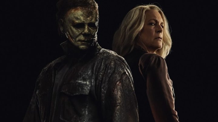 Michael Myers and Laurie Strode stand back to back in a poster from Halloween Ends.
