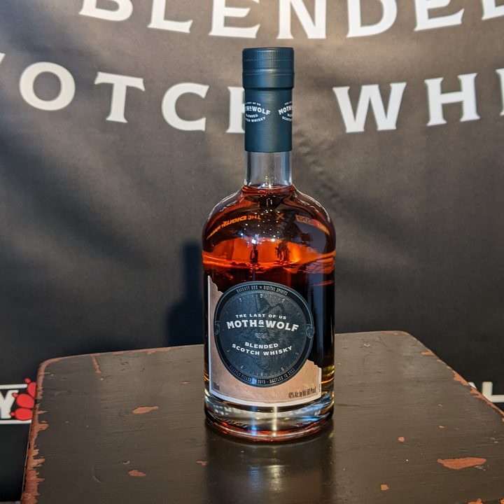 A bottle of whiskey inspired by The Last of Us sits on a table.