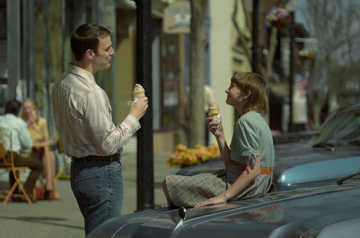 Jake Lacy and Hendrix Yancey eat ice cream in a scene from A Friend of the Family.