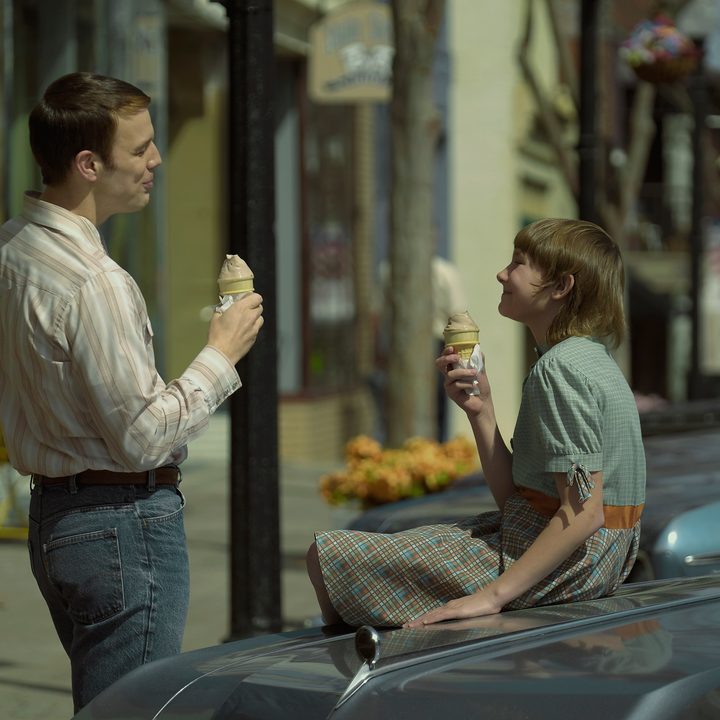 Jake Lacy and Hendrix Yancey eat ice cream in a scene from A Friend of the Family.