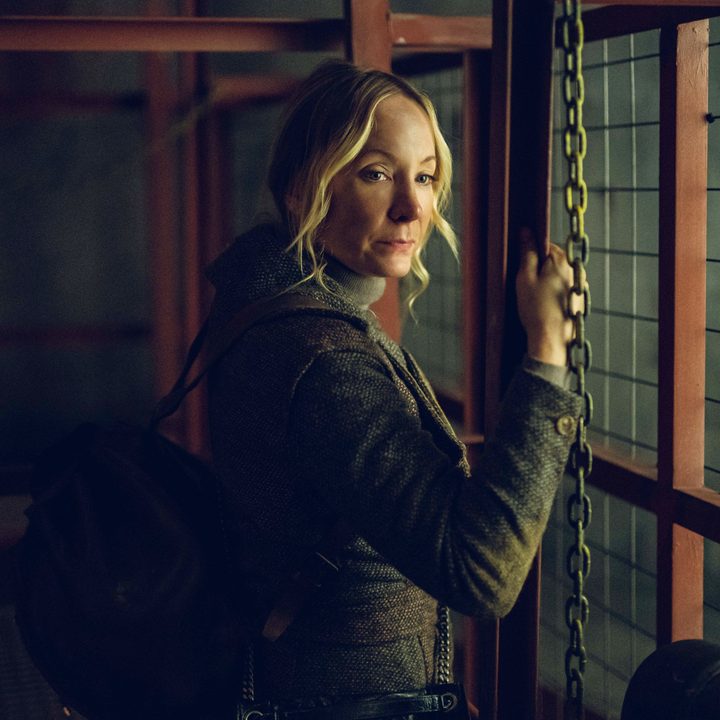Joanne Froggatt holding onto a fence in a scene from Last Light.