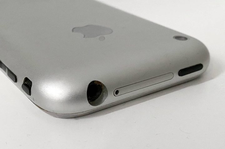 Original iPhone showing headphone jack and SIM card slot.