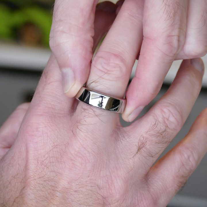 Putting the Oura Ring on a finger.